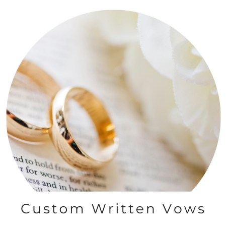 two wedding bands over written wedding vows